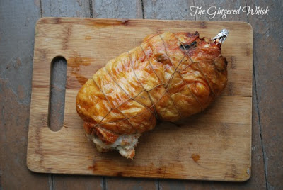 Stuffed Chicken Breast - The Gingered Whisk freshly baked chicken ballotine on wooden cutting board