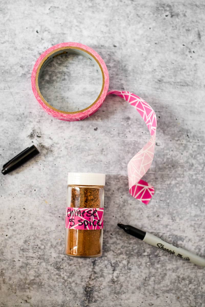 homemade chinese five spice in glass container with washi tape and marker