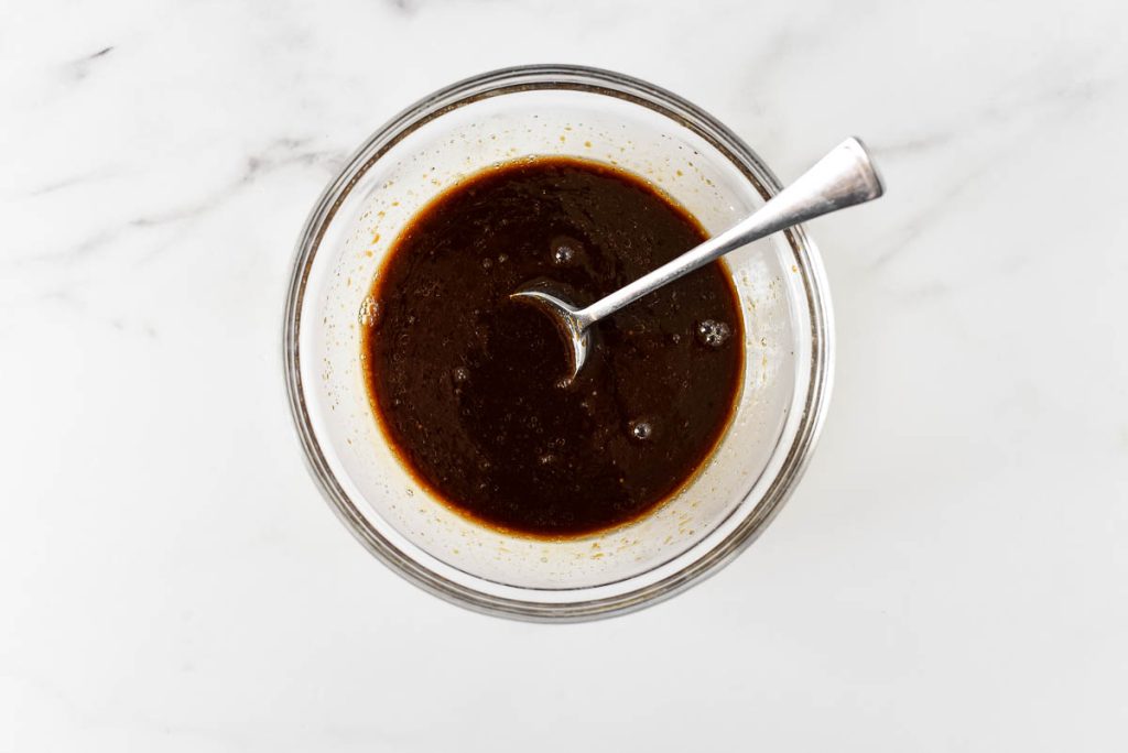 bowl with kung poa chicken sauce