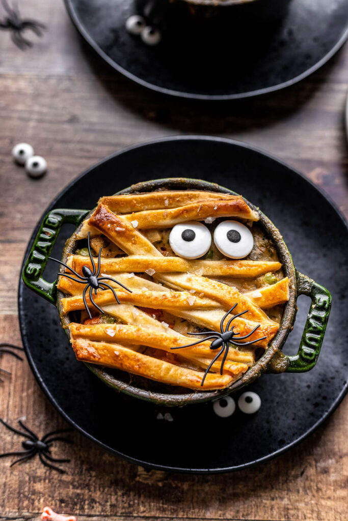 mini pot pie with dough strips to look like mummy bandages and candy eyeballs