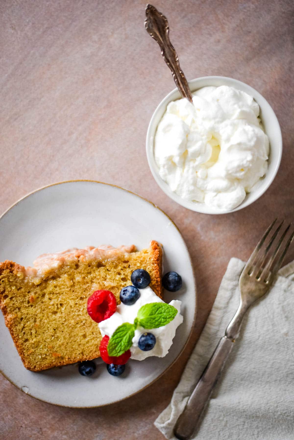 slice of pound cake next to whipped cream