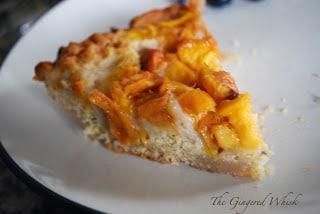 slice of peach cake on white plate