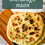 sourdough naan with text overlay of recipe name for pinterest